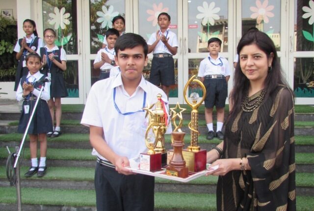 Tanishq Gupta of class VIII with his championship trophies